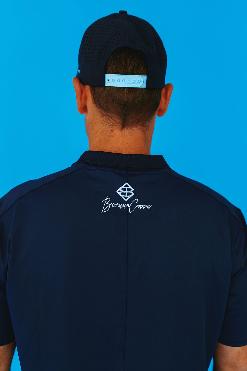 Brianna Cannon - BC Men’s Navy and Columbia Blue Golf Polo